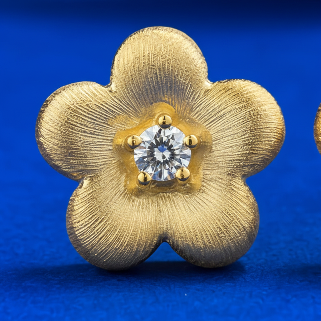 Close-up detail of brushed gold petals and diamond center