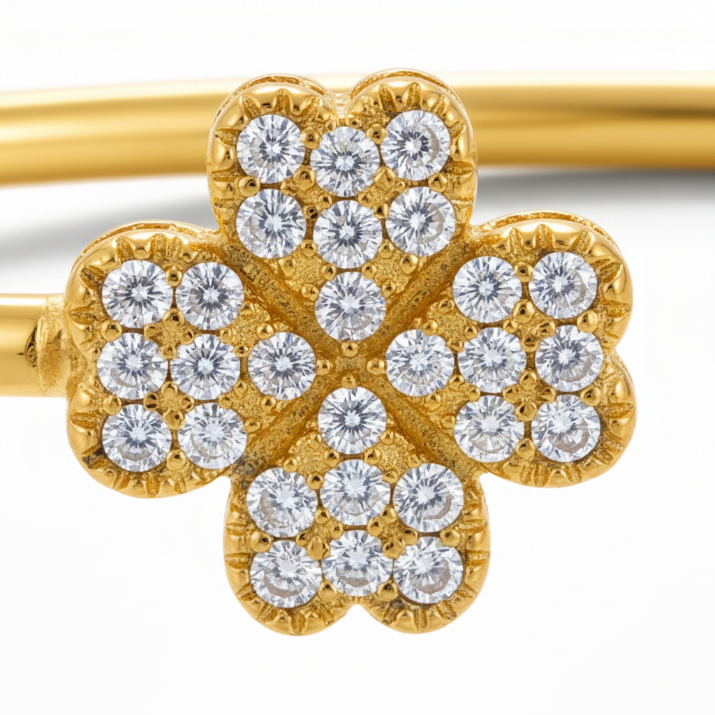 Close-up detail of diamond-pavé clover and metal texture - version 2