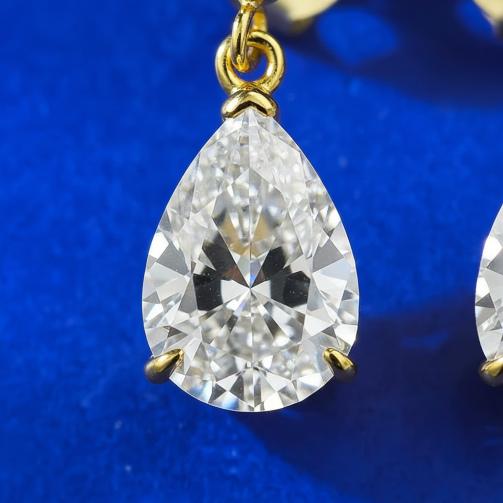 Close-up detail of pear-shaped diamond and gold setting