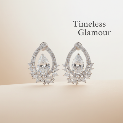 Diamond chandelier earrings with "Timeless Glamour" text overlay