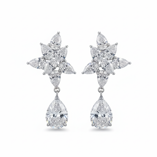 Diamond flower cluster drop earrings on white background