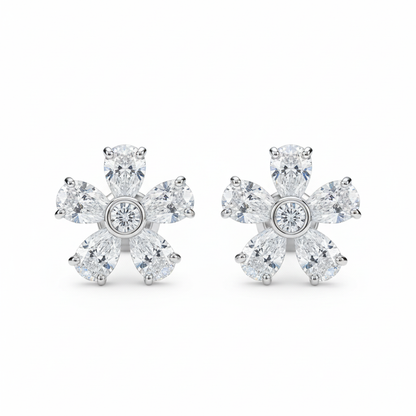 Diamond flower stud earrings on white background