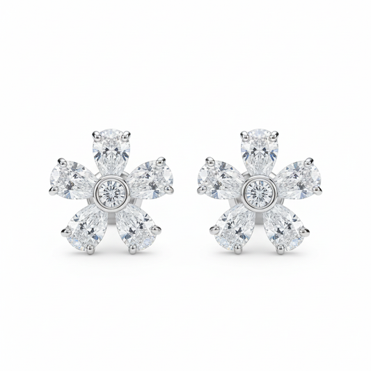 Diamond flower stud earrings on white background