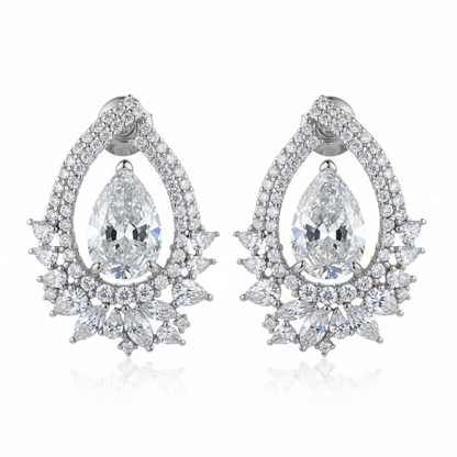 Elaborate diamond chandelier earrings on white background