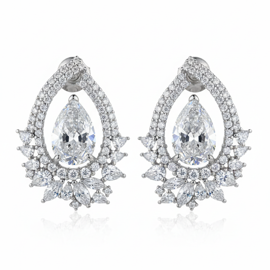 Elaborate diamond chandelier earrings on white background