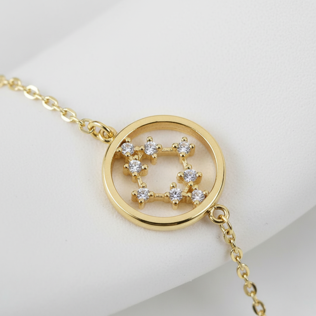 Gold cross bracelet macro detail