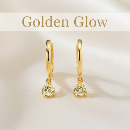Gold hoop earrings with yellow diamonds with "Golden Glow" text overlay