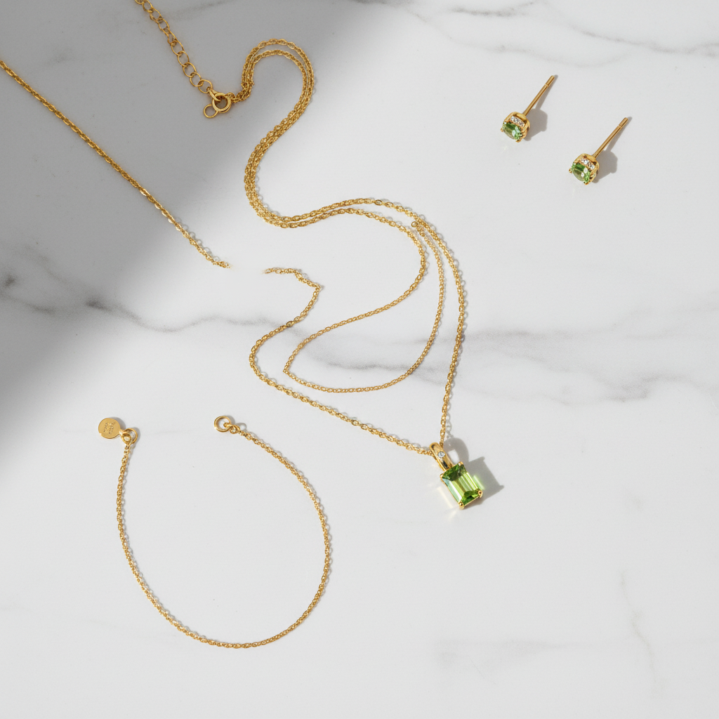 Green crystal pendant flat lay styling