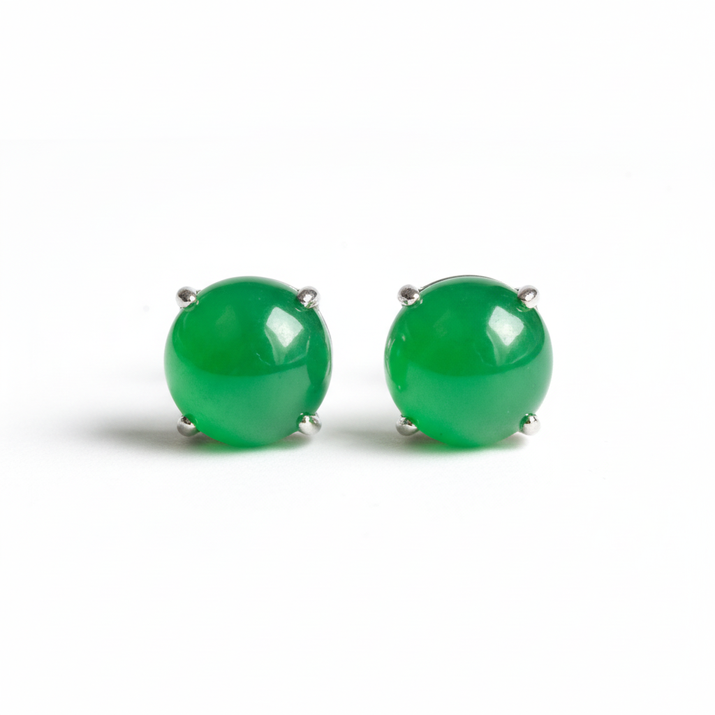 Green jade stud earrings on white background