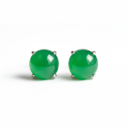 Green jade stud earrings on white background