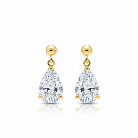 Pear-shaped diamond drop earrings on white background