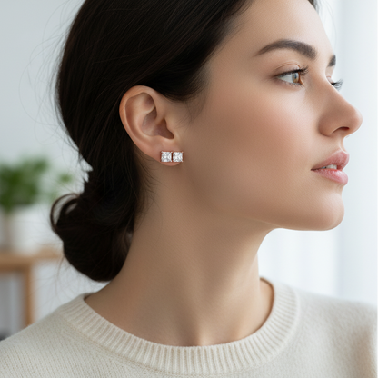 Woman wearing princess-cut diamond stud earrings - lifestyle shot 1