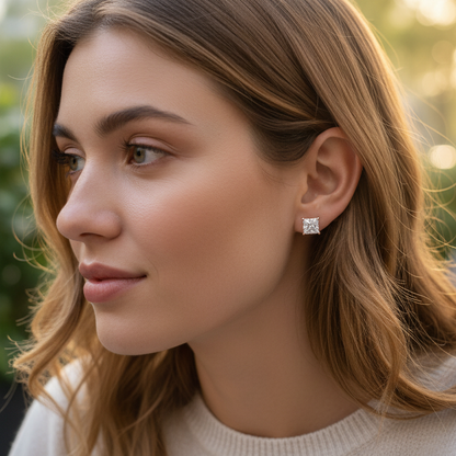 Woman wearing princess-cut diamond stud earrings - lifestyle shot 2