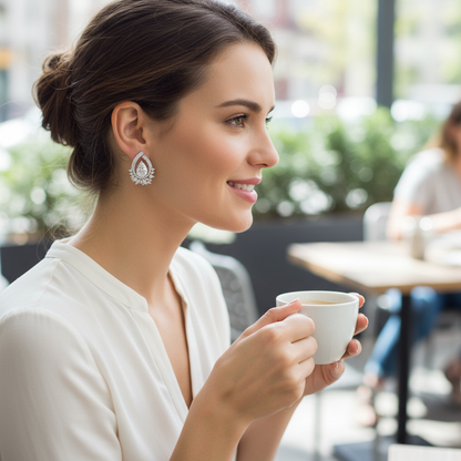 Woman wearing small delicate diamond chandelier earrings - lifestyle shot 1