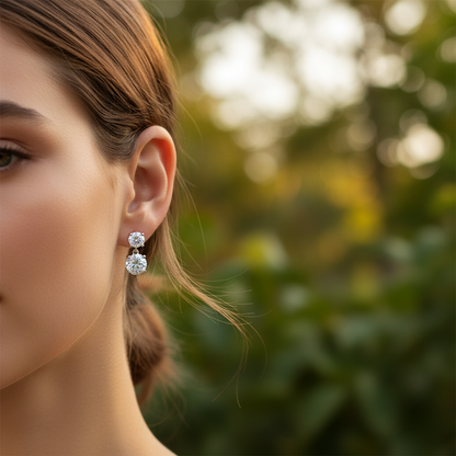 Woman wearing small delicate diamond drop earrings - lifestyle shot 2